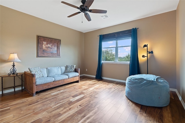 sitting room featuring ceiling fan and light hardwood / wood-style flooring