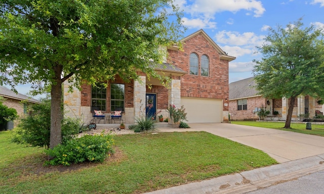 view of front of home with a garage and a front lawn