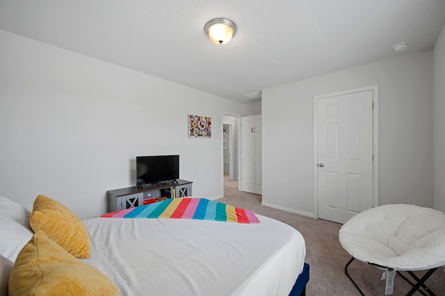 bedroom with light colored carpet