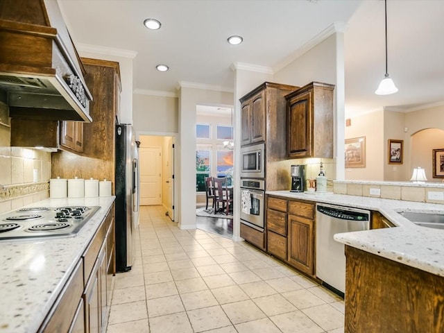 717 Fallow, Horseshoe Bay, TX 78657 - kitchen with stainless steel appliances, ventilation hood, backsplash, light stone countertops, and recessed lighting