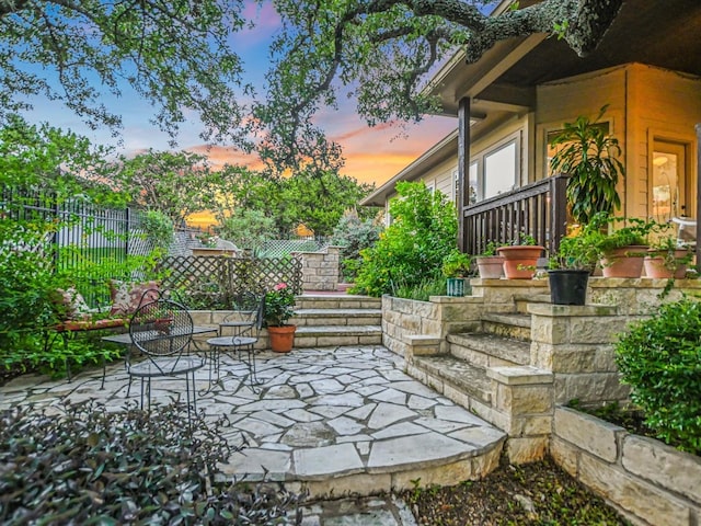 view of patio terrace at dusk