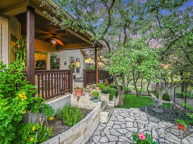 view of patio featuring ceiling fan