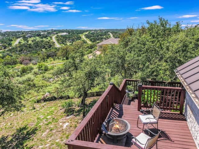 717 Fallow, Horseshoe Bay, TX 78657 - deck featuring a fire pit and a forest view