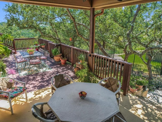 717 Fallow, Horseshoe Bay, TX 78657 - view of patio / terrace with outdoor dining area, a deck, and view of scattered trees