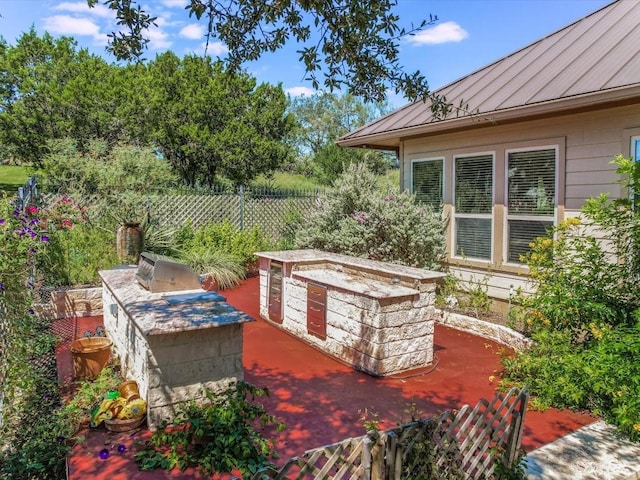 717 Fallow, Horseshoe Bay, TX 78657 - view of patio / terrace featuring an outdoor kitchen