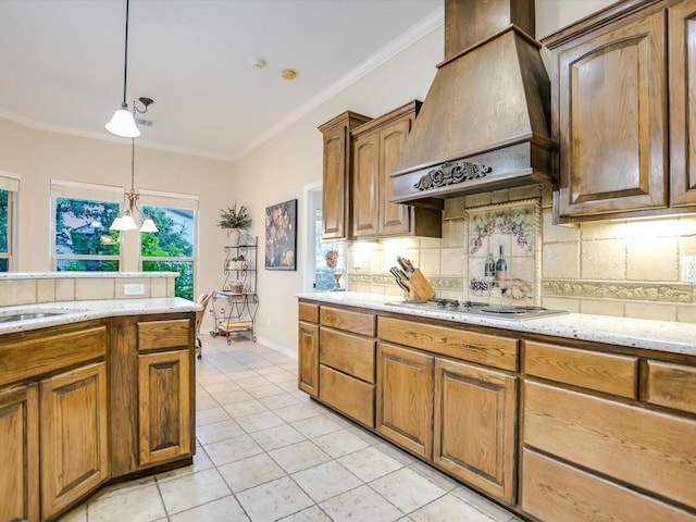 717 Fallow, Horseshoe Bay, TX 78657 - kitchen with custom range hood, tasteful backsplash, pendant lighting, crown molding, and light tile patterned floors