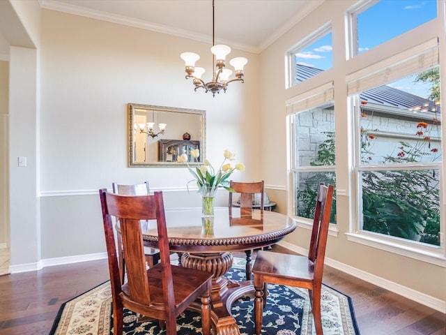 dining room with ornamental molding, dark wood-type flooring, and an inviting chandelier