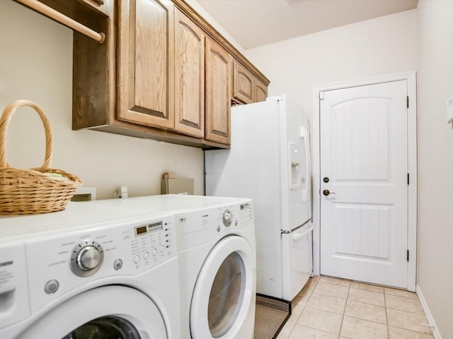 717 Fallow, Horseshoe Bay, TX 78657 - laundry area with washer and dryer, cabinet space, and light tile patterned floors