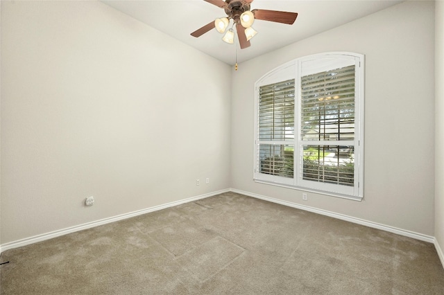 carpeted empty room with ceiling fan