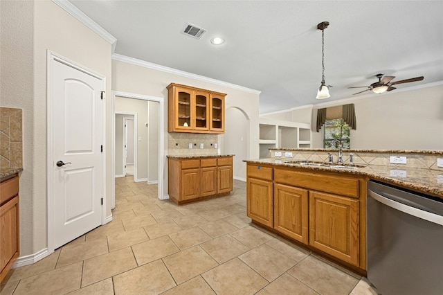 kitchen featuring dishwasher, tasteful backsplash, crown molding, ceiling fan, and light stone counters