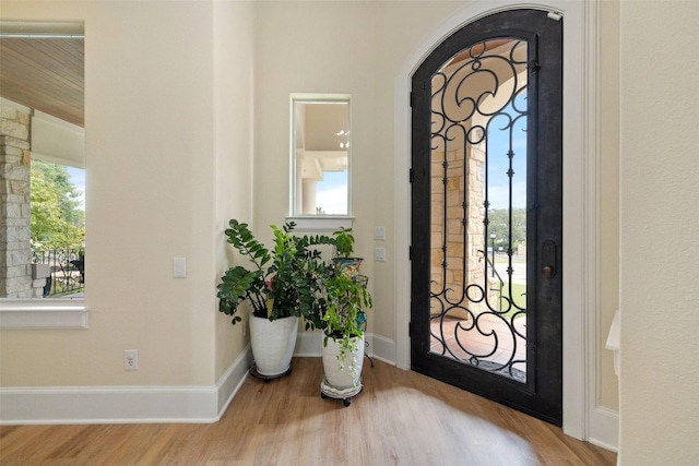 foyer entrance with light hardwood / wood-style floors