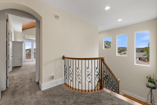 hallway featuring carpet flooring