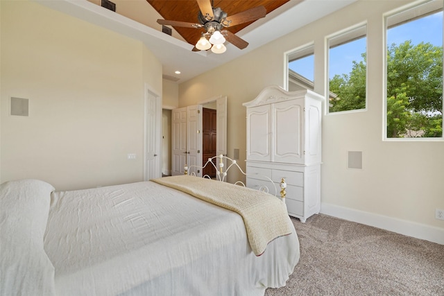 bedroom with ceiling fan and light carpet