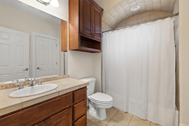 bathroom with vanity, toilet, and tile patterned flooring