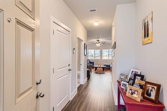 hallway featuring dark wood-type flooring