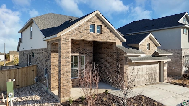 view of front of property with a garage