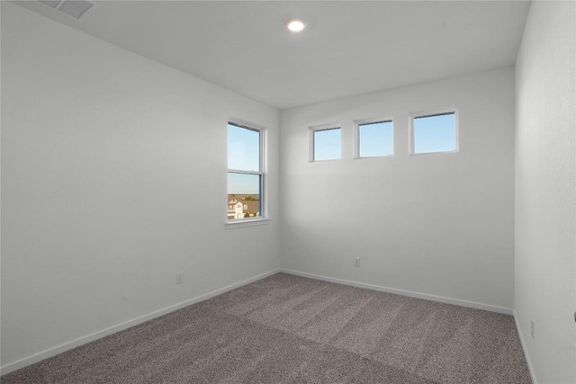 spare room with carpet flooring