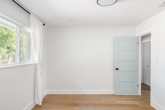 spare room featuring light hardwood / wood-style flooring