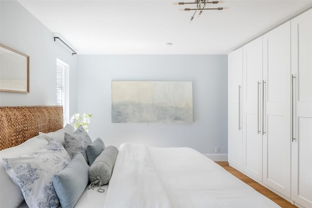 bedroom with light wood-type flooring