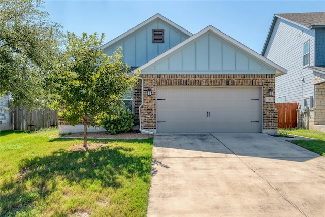 view of front of house featuring a garage and a front yard