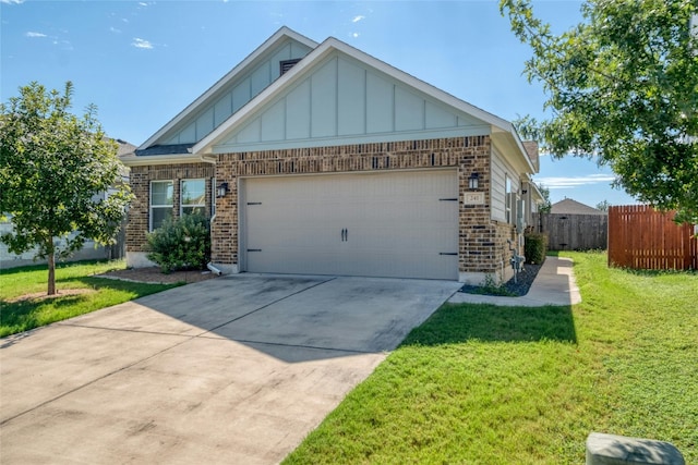 view of front of home featuring a garage and a front lawn