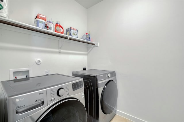 washroom with separate washer and dryer