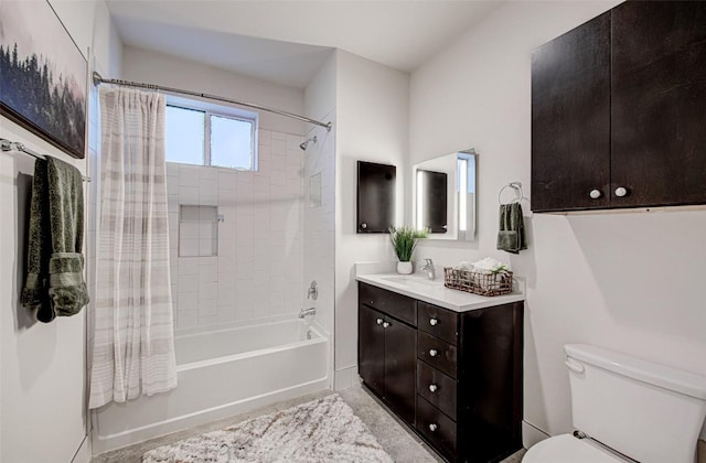 full bath with toilet, vanity, and shower / bath combo with shower curtain