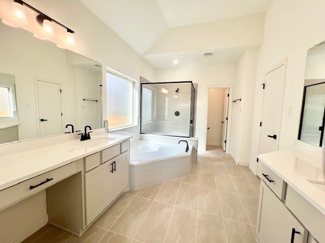 bathroom with vanity, shower with separate bathtub, lofted ceiling, and tile patterned floors