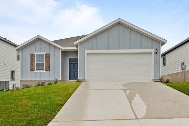 ranch-style house with central air condition unit, a front yard, and a garage