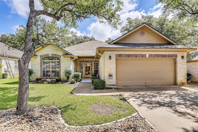 single story home with a garage and a front yard