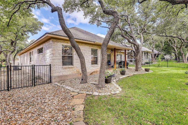 back of house featuring a yard and a patio