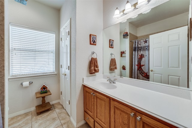 bathroom with vanity and tile patterned floors