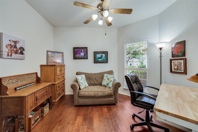 office space featuring dark wood-type flooring and ceiling fan