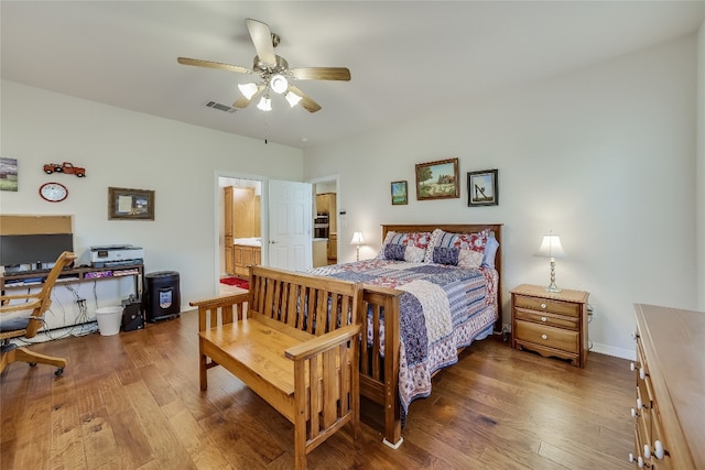 bedroom with ceiling fan, hardwood / wood-style flooring, and connected bathroom