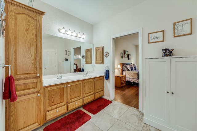 bathroom with vanity and hardwood / wood-style flooring