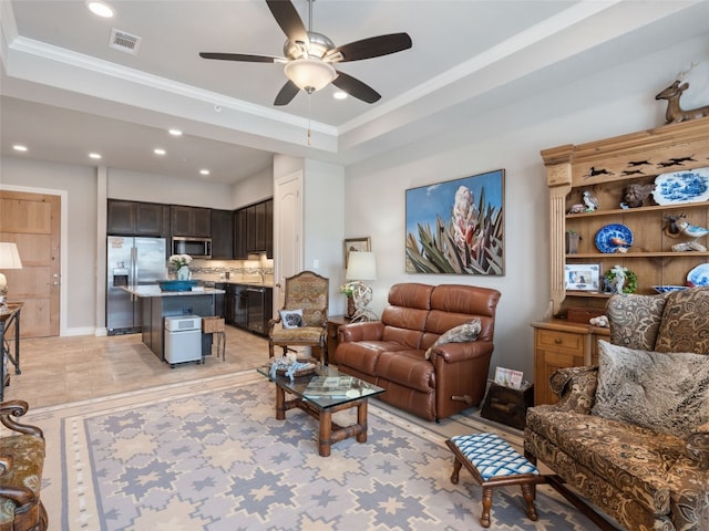 living room with ceiling fan, ornamental molding, and light tile patterned flooring