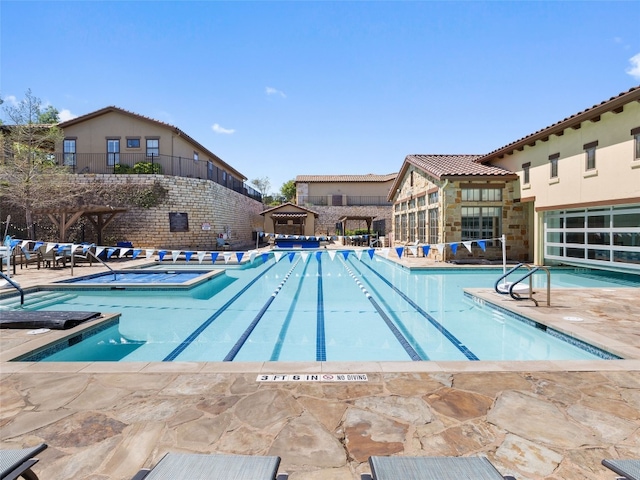 view of pool featuring a patio area