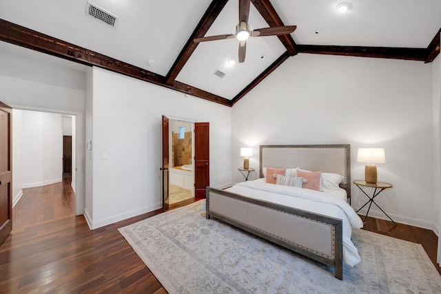 bedroom with high vaulted ceiling, beam ceiling, dark wood-type flooring, ceiling fan, and connected bathroom