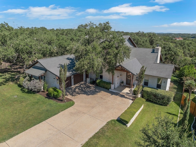 view of front of house featuring a garage and a front yard