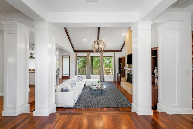 unfurnished living room featuring dark hardwood / wood-style floors, vaulted ceiling with beams, a notable chandelier, and ornate columns