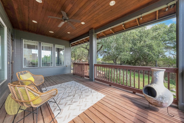 wooden deck with ceiling fan