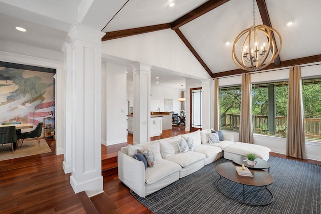 living room featuring decorative columns, lofted ceiling with beams, dark hardwood / wood-style floors, and an inviting chandelier