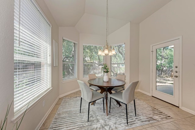 tiled dining area featuring a notable chandelier and vaulted ceiling