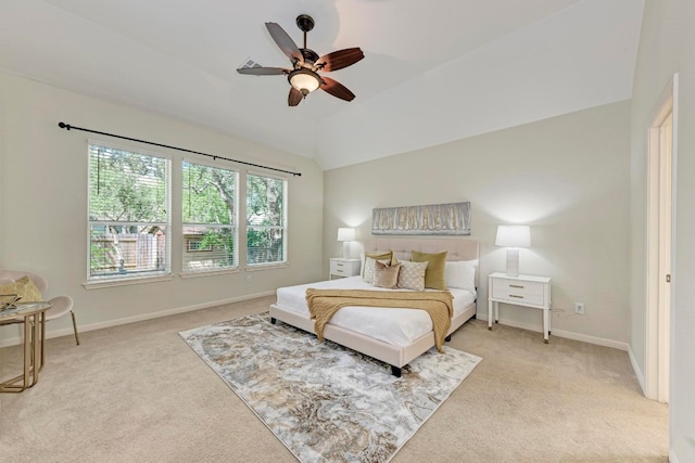 carpeted bedroom featuring lofted ceiling and ceiling fan