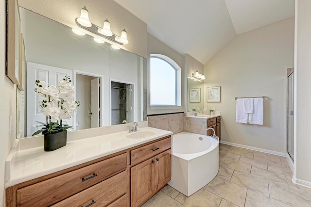 bathroom with vanity, lofted ceiling, independent shower and bath, and tile patterned flooring