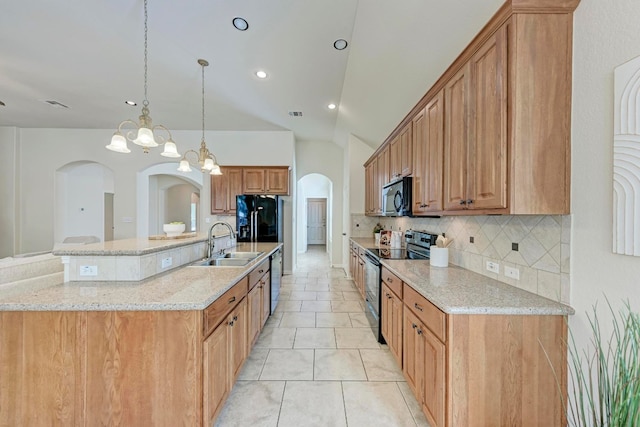 kitchen with a notable chandelier, a spacious island, black appliances, sink, and hanging light fixtures