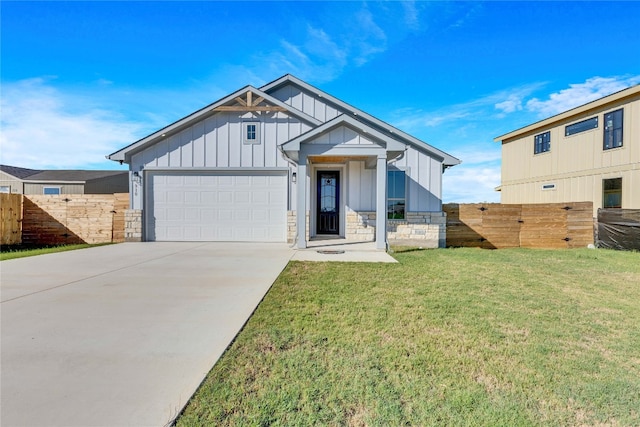 view of front of home with a front lawn and a garage