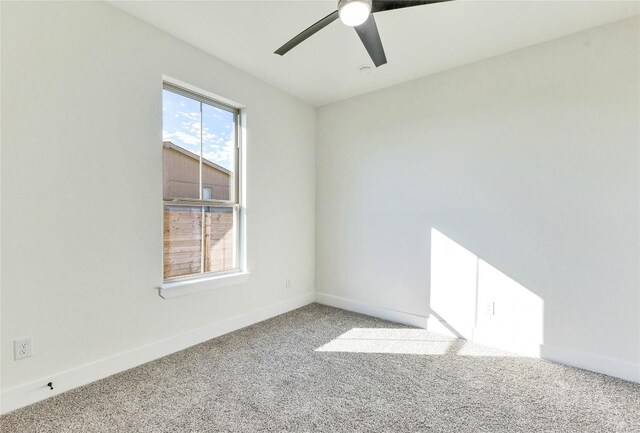 unfurnished room featuring ceiling fan and carpet