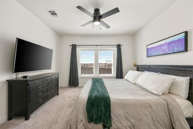 bedroom featuring ceiling fan and light carpet