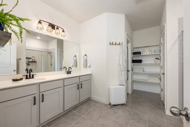 bathroom featuring tile patterned flooring, vanity, and an enclosed shower